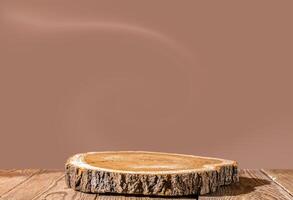 Slice wooden podium round saw cut of a tree on a mocha mousse color background. Still life for the presentation of products. photo