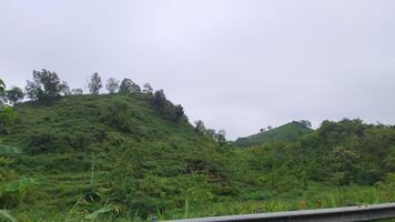 a view of a mountain range from a car photo