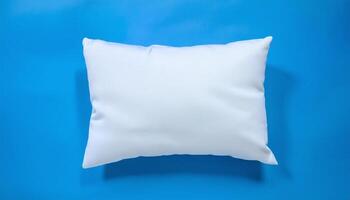 White Pillow Resting on a Blue Surface photo