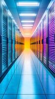 Brightly lit corridor in a modern data center showcasing server racks with colorful illumination photo