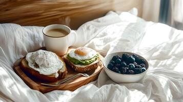 Morning breakfast on a cozy bed with eggs, avocado toast, fresh berries, and coffee in a quiet, sunlit room photo