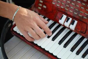 Hands Of A Player Preparing To Play Accordion photo