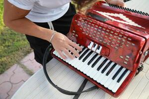 Hands Of A Player Preparing To Play Accordion photo
