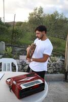 Happy Tambourine Player Performing in Fields photo