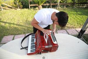 Professional Player Fixing And Tuning The Accordion photo