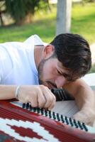 Professional Player Fixing And Tuning The Accordion photo