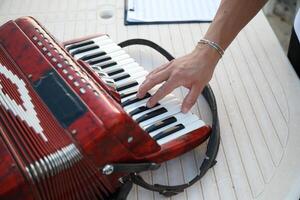 Musician's Fingers Dancing Over Accordion Keys photo