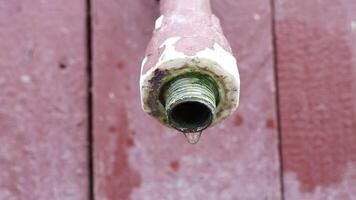 This is a CloseUp Image of a Rusty Pipe Fitting Resting on a Wooden Surface for Detail video