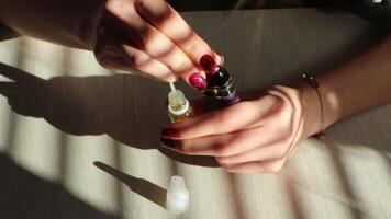 Hands Skillfully Preparing Vape Oil Surrounded by Bright and Artistic Shadows in a Studio video