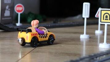 An exciting toy car positioned on a vibrant playset, complete with various traffic signs nearby video