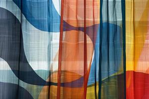 Sunlight shining through colorful abstract patterned curtains photo