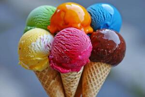 Colorful ice cream scoops in waffle cones on blurred background photo