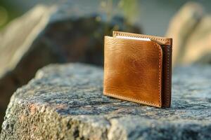 Leather wallet resting on a rock displaying quality craftsmanship photo