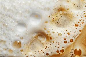 Coffee foam texture forming bubbles on the surface of hot drink photo