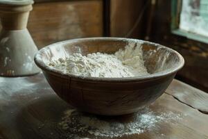 Wooden bowl brimming with flour creates rustic baking scene photo