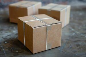 Cardboard boxes tied with string sitting on metal table photo