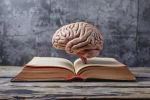 Human brain floating over open book on wooden table, exploring the power of knowledge photo