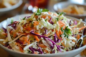 Freshly made coleslaw with red and green cabbage sitting in serving bowl photo