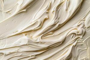 Creamy swirls of butter creating a smooth texture background photo