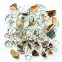 Pile of sharp broken glass shards lying on white background photo