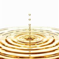 Golden liquid drop splashing and creating ripples on white background photo