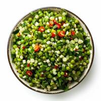 Fresh green peas salad with herbs and chili pepper in bowl photo