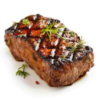 Grilled beef steak with herbs and spices on white background photo