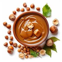 Hazelnut cream with whole hazelnuts in rustic bowl photo