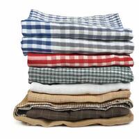 Stack of folded kitchen cloths with checkered patterns creating a colorful pile photo