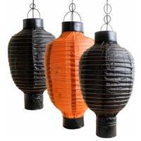 Three hanging paper lanterns creating a festive atmosphere photo