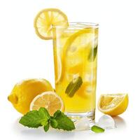 Refreshing lemonade with ice, lemon slices and mint on white background photo