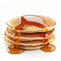 Stack of pancakes dripping with maple syrup on white background photo