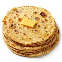 Stack of buttery flatbreads with a square of cheese melting on top photo