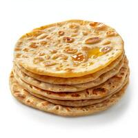 Stack of whole wheat chapati flatbreads with ghee topping photo