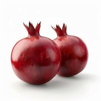 Two ripe pomegranates resting on a white surface photo