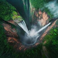 Aerial View of a Majestic Waterfall Plunging into a Canyon photo