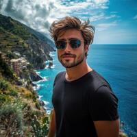 Relaxed Man in Sunglasses on a Coastal Cliff photo
