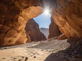 Sunbeams piercing a desert canyon photo