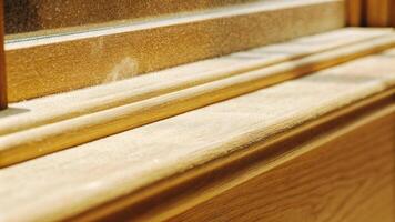 Macro shot of a dusty window sill with a shallow depth of field, highlighting the texture of the dust photo