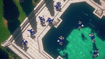 Aerial view of a vibrant pool scene with people enjoying leisure time, surrounded by lush greenery photo