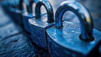 Close-up view of a row of blue padlocks on a textured surface, symbolizing security and protection photo