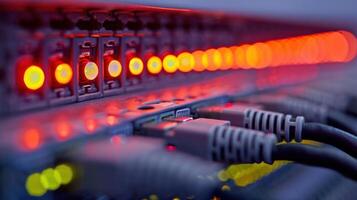 Close-up view of illuminated network switches and cables in a data center environment photo