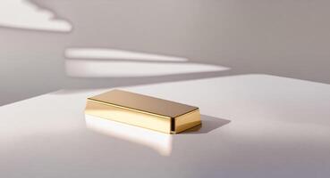 Gold Bar on a Clean White Surface with Soft Shadows photo