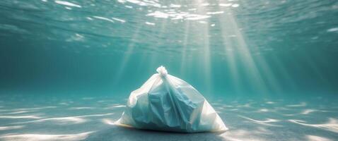 Crumpled plastic bag on the ocean floor with sunlight filtering through water photo