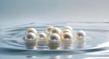 A bunch of pearls are floating in the water photo