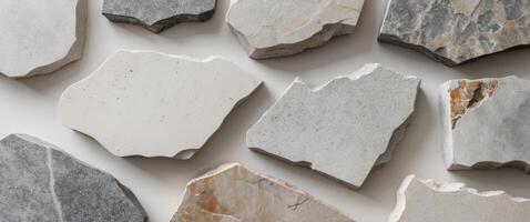 A medium closeup of textured stone slabs highlighting a mix of smooth and jagged edges. photo