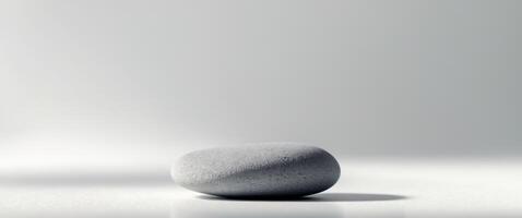 Single Pebble A pebble with a smooth outline and subtle texture photo
