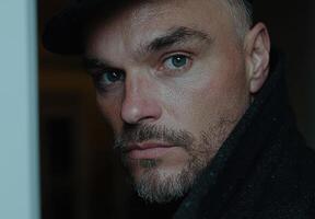 Close up portrait of a man with a serious expression photo