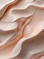 Abstract background of swirls and waves of pale peach cream texture photo