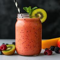 Delicious and refreshing fruit smoothie in a mason jar photo